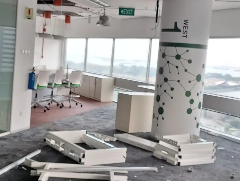 Cleared office floor with columns, ready for make-good works